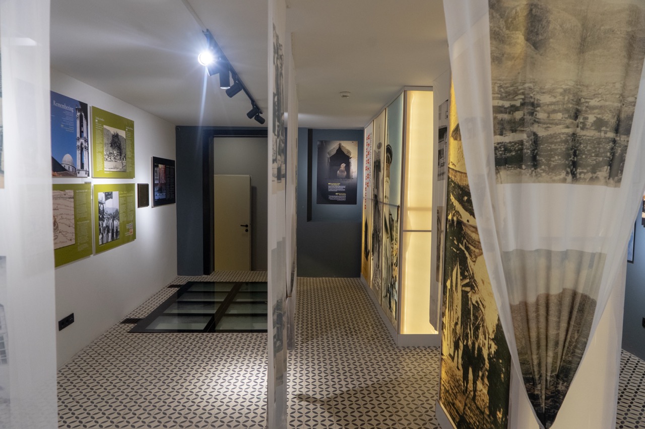 Visitors viewing photographs in the Antakya exhibition